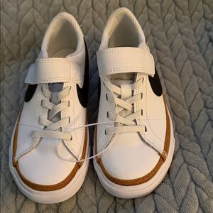 Nike Kids White Sneakers with Brown Trim and Black Swoosh